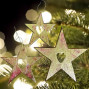 handmade and hand painted golden stars with heart cut out Christmas tree decoration