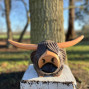 a hand carved outdoor wooden bear sculpture, smiling happy bear