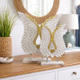 carved wooden angel wings on plinth