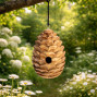 hand carved birdhouse, one way up an acorn the other a beehive