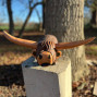 hand carved long horn highland cow with a questionable look on its face, such a tactile funny character