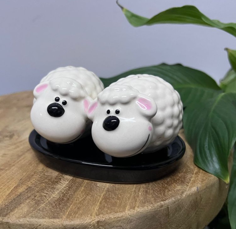 a set of ceramic All white sheep salt and pepper shakers on a ceramic base