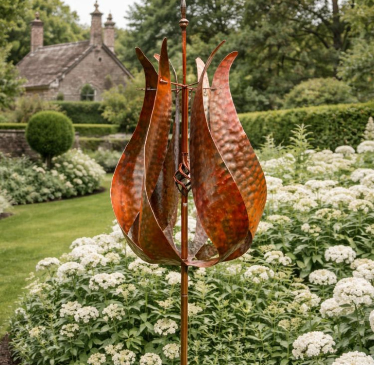 The Painswick Metal Garden Wind Spinner on a stake