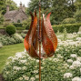 The Painswick Metal Garden Wind Spinner on a stake