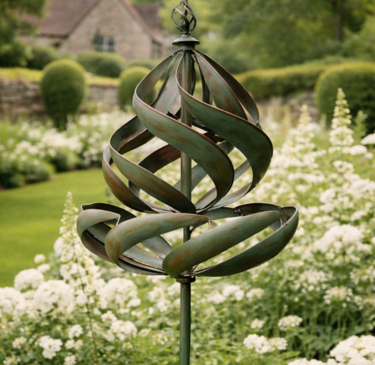 The Sudeley Metal Garden Wind Spinner on a stake
