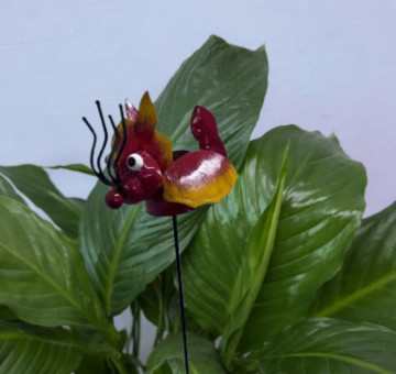 a metal outdoor indoor mini plant stake for your pot in the design of a yellow flower