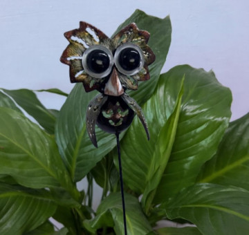 a metal outdoor indoor mini plant stake for your pot in the design of an owl