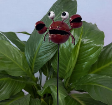 a metal outdoor indoor mini plant stake for your pot in the design of an owl