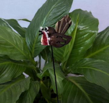 a metal outdoor indoor mini plant stake for your pot in the design of an owl