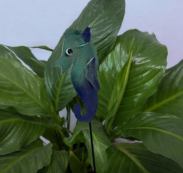 a metal outdoor indoor mini plant stake for your pot in the design of a seahorse