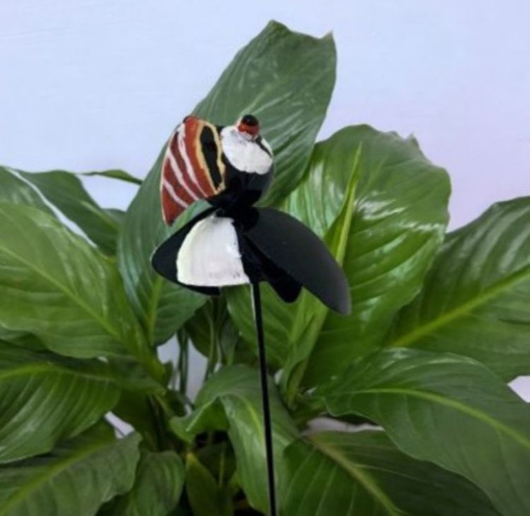a metal outdoor indoor mini plant stake for your pot in the design of a seahorse