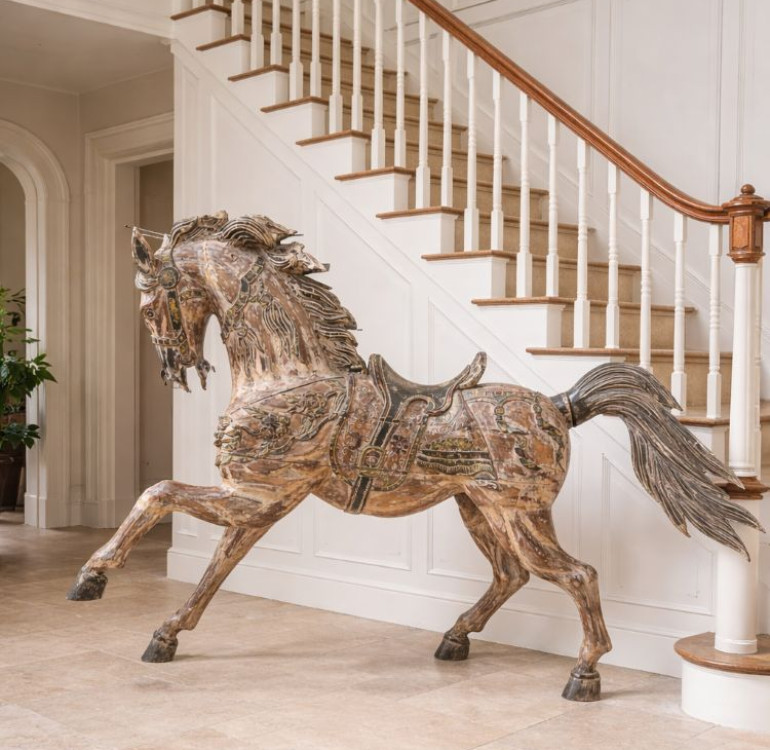 hand carved vintage horse sculpture, eyecatching, shappy chic with a carousel horse apprearance.