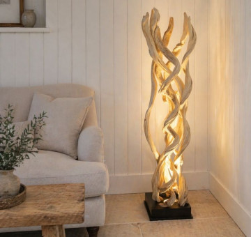 a sculptural eye-catching handcrafted plug in floor lamp made from dangled dried vines