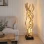 a sculptural eye-catching handcrafted plug in floor lamp made from dangled dried vines