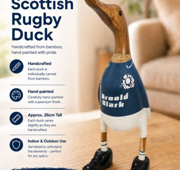 an image of a handcarved and hand painted bamboo duck with the character of a scottish rugby player