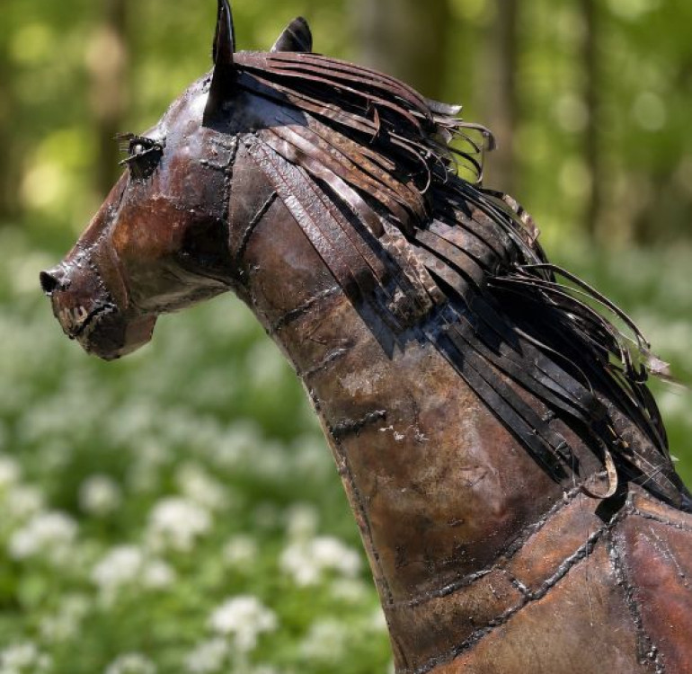 a recycled metal horse sculpture, statue for the garden
