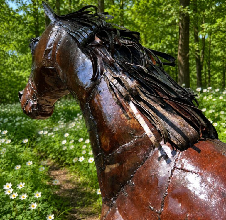 a recycled metal horse sculpture, statue for the garden
