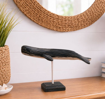 a hand carved and hand painted whale