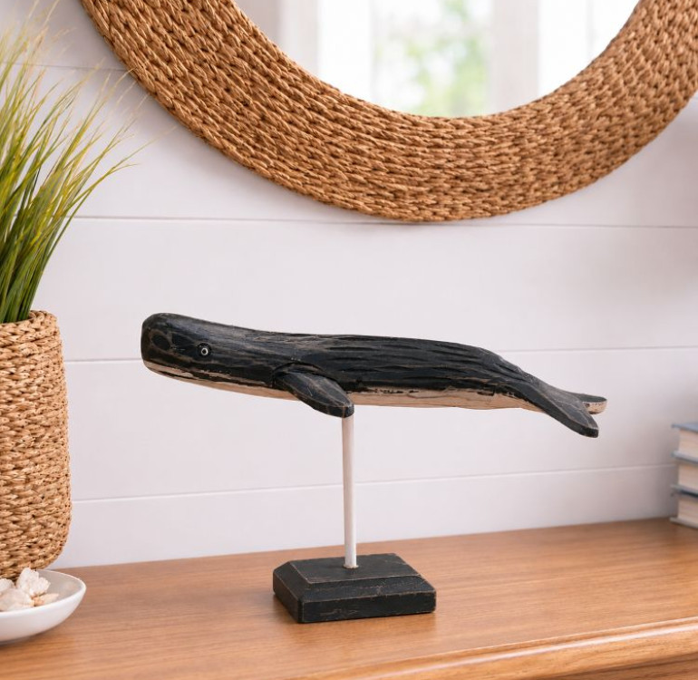 a hand carved and hand painted whale