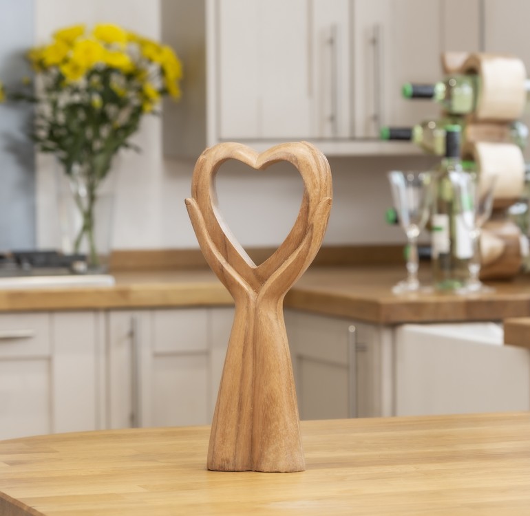 Hand carved in indonesia from suar wood.