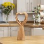 Hand carved in indonesia from suar wood.