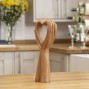 Hand carved in indonesia from suar wood.